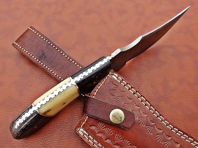 9.5" Long full tang blade skinning Knife, Rain drop pattern trailing point blade, hand forged Damascus steel, 2 tone black wood and Camel bone scale, Cow Leather sheath