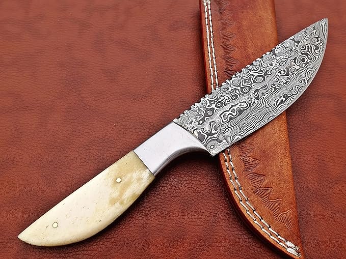 9.5" Walnut wood scale with steel bolster skinning Knife, full tang blade Rain drop pattern straight back hand forged Damascus steel, Cow Leather sheath (White)